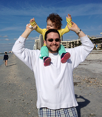Daddy with Emerson behind Dan's Island Sandkey Beach Condo - Thumbnail