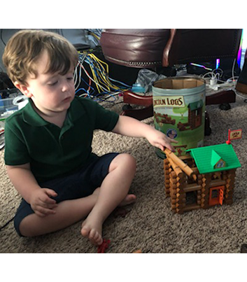 Lachlan playing with Lincoln Logs by Daddy's Desk - Thumbnail