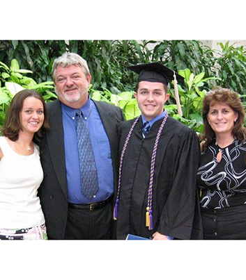 Justin, his Parents Jerry and Nancy, and his sister Kimberly at his Undergrad College Graduation - Thumbnail
